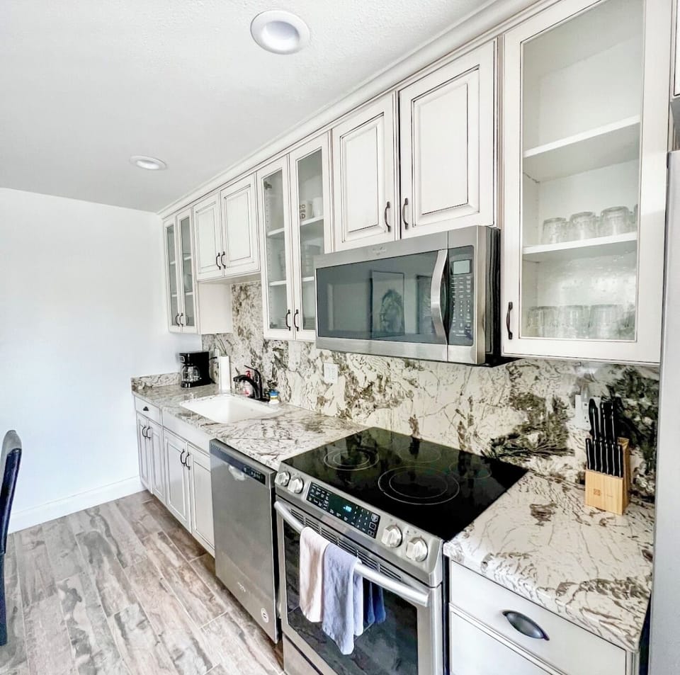 Fully equipped kitchen with pantry, heated floors!