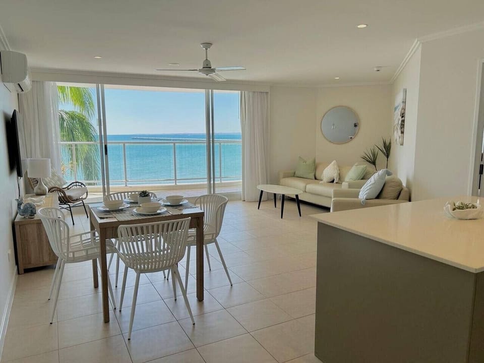 Bright living and dining area with beautiful sea views.