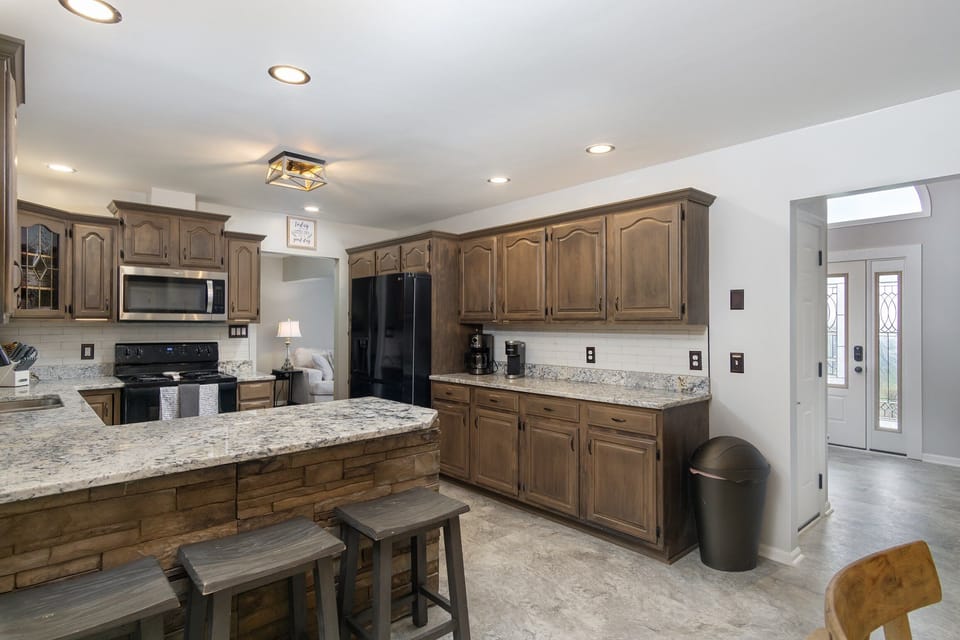 Fully Equipped Kitchen with Bar seating for 3