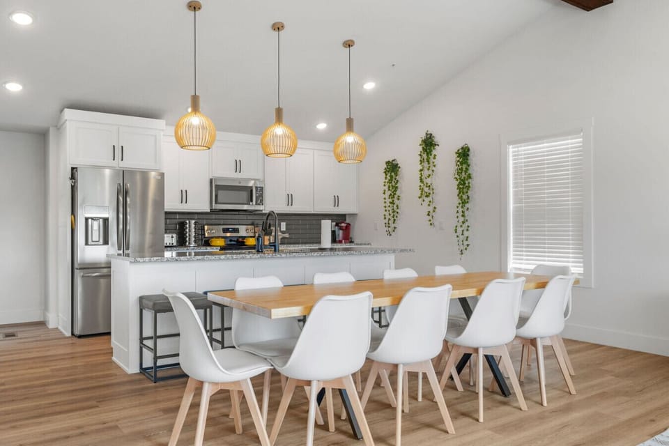 Modern kitchen and long dining table make group meals easy, whether it’s a cozy breakfast or a family-style dinner.