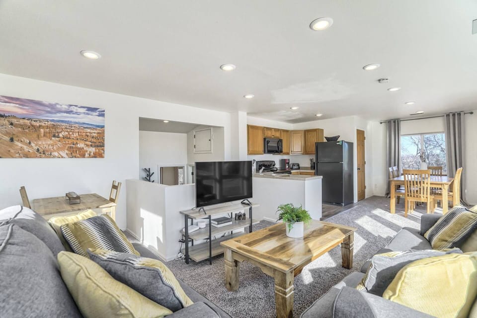 Living room, upstairs, with full kitchen -and all the sunlight!