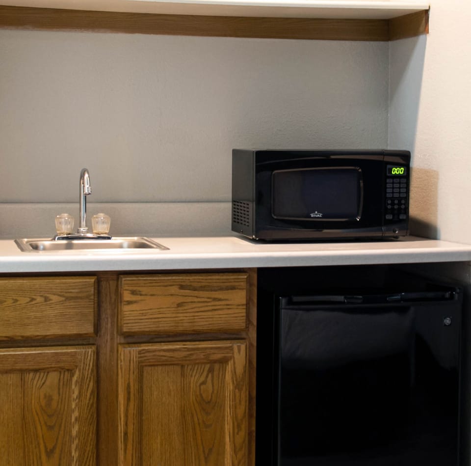Suite, Multiple Beds | Desk, laptop workspace, blackout drapes, iron/ironing board