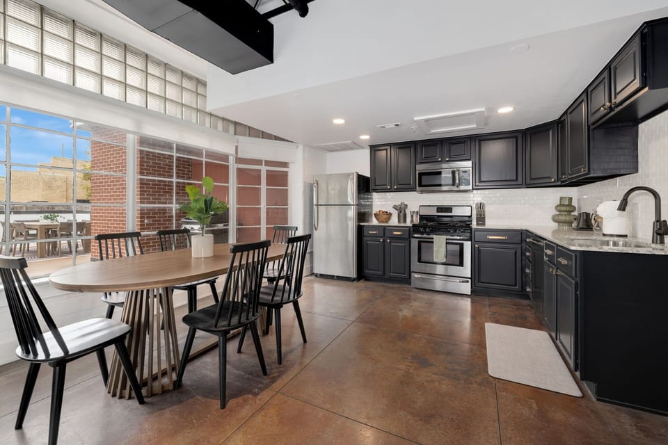 Spacious kitchen and dining area with natural light and modern finishes.