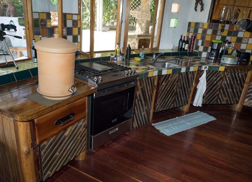 fully equipped kitchen with new stove and waterfilter