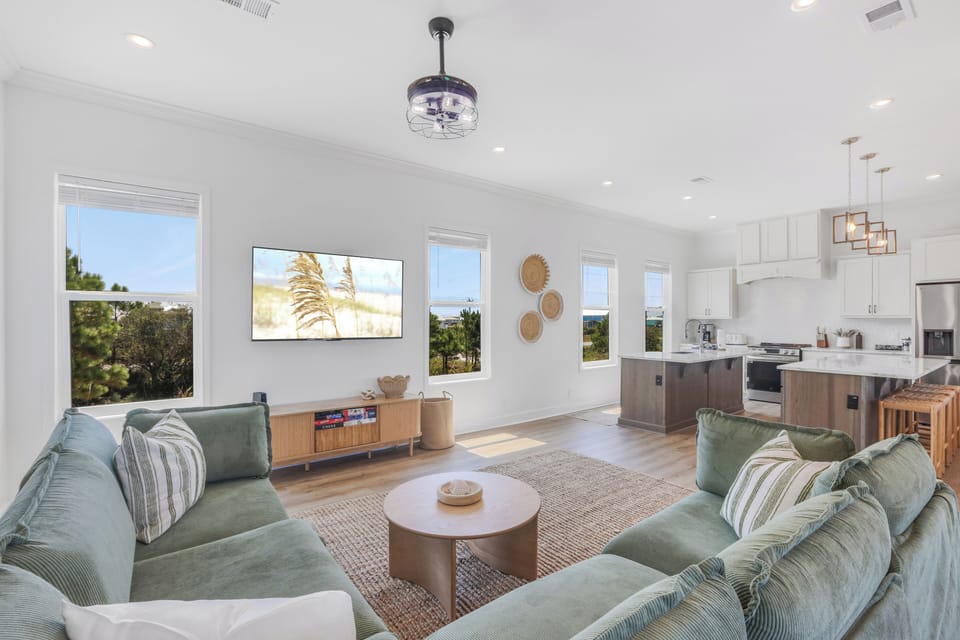 Bright, open-concept living! Gather in the airy living room with a big-screen TV