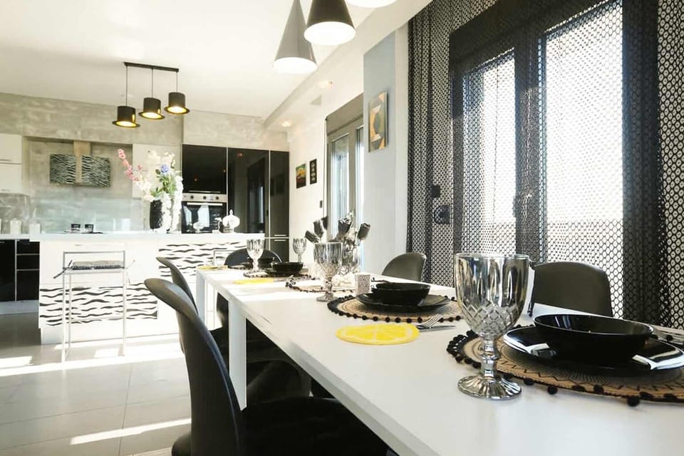 Modern Dining Area with Garden Views and Bright, Airy Surroundings