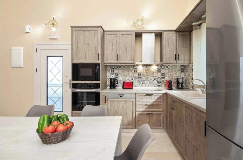 Stylish Open Kitchen with Full Amenities for Effortless Meal Preparation