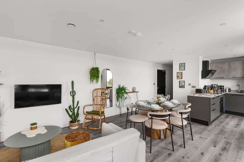 Clean lines, warm wood, and a touch of greenery.