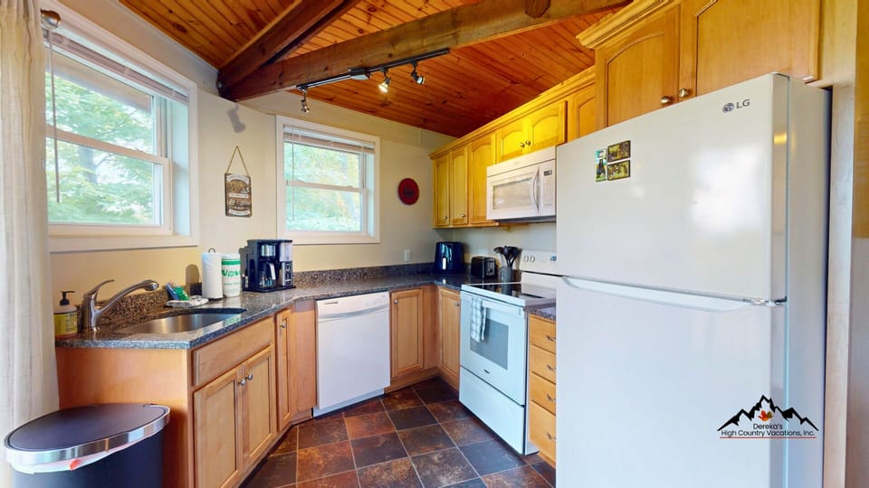 Cook, gather, and unwind in this bright space designed for easy mountain living.