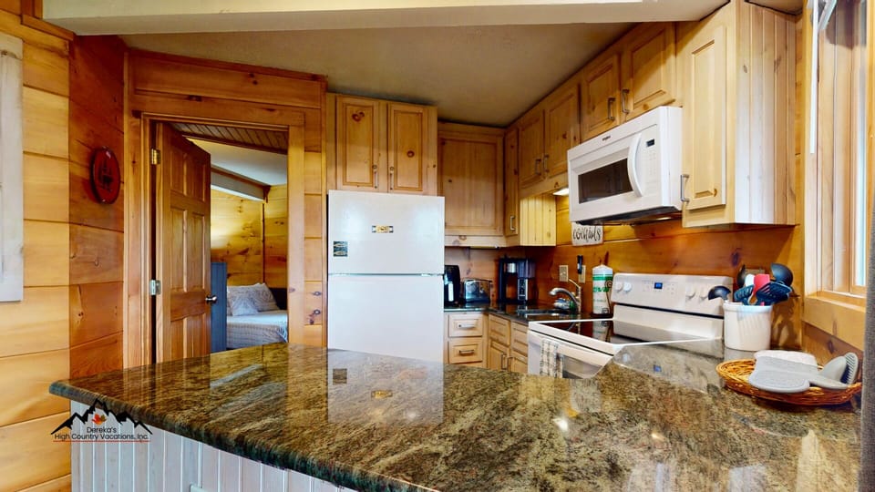 The open kitchen and dining area makes it easy to cook, dine, and relax as a group.