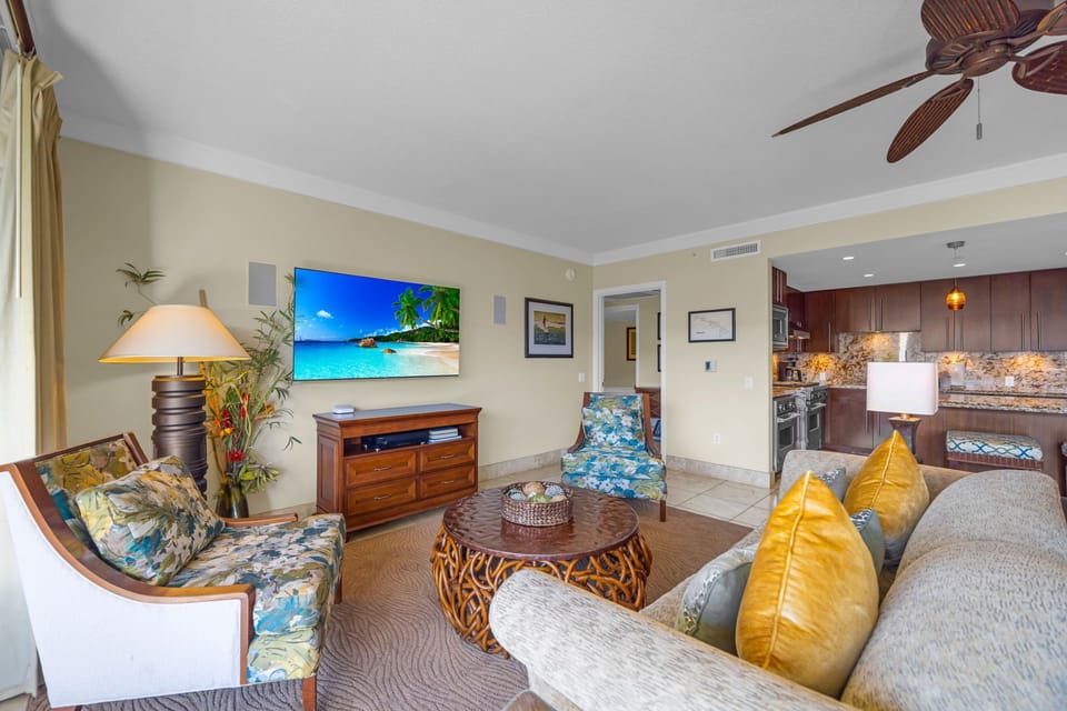 Living room with large windows and warm tones offers both comfort and connection to the outdoors. HKH-504