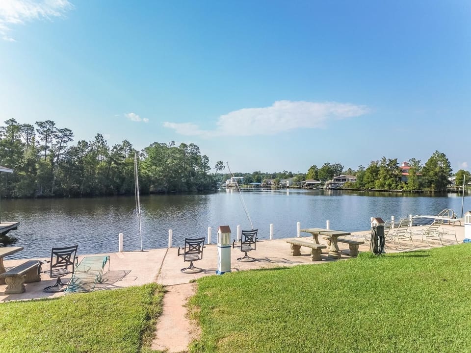 Enjoy serene river views from the private dock, perfect for fishing or relaxing under the sun.