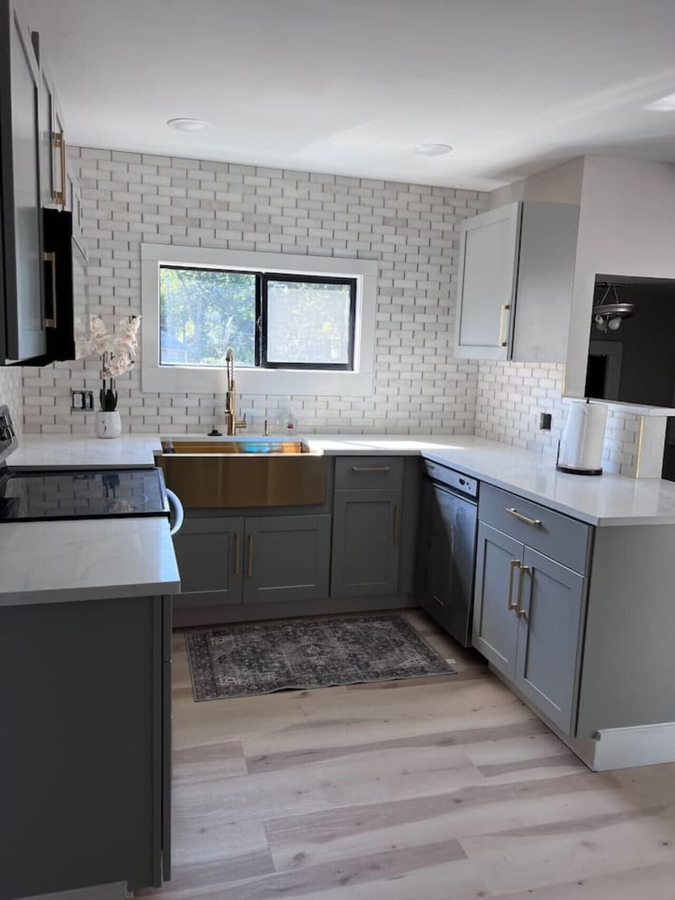 Kitchen with gold sink and dishwasher