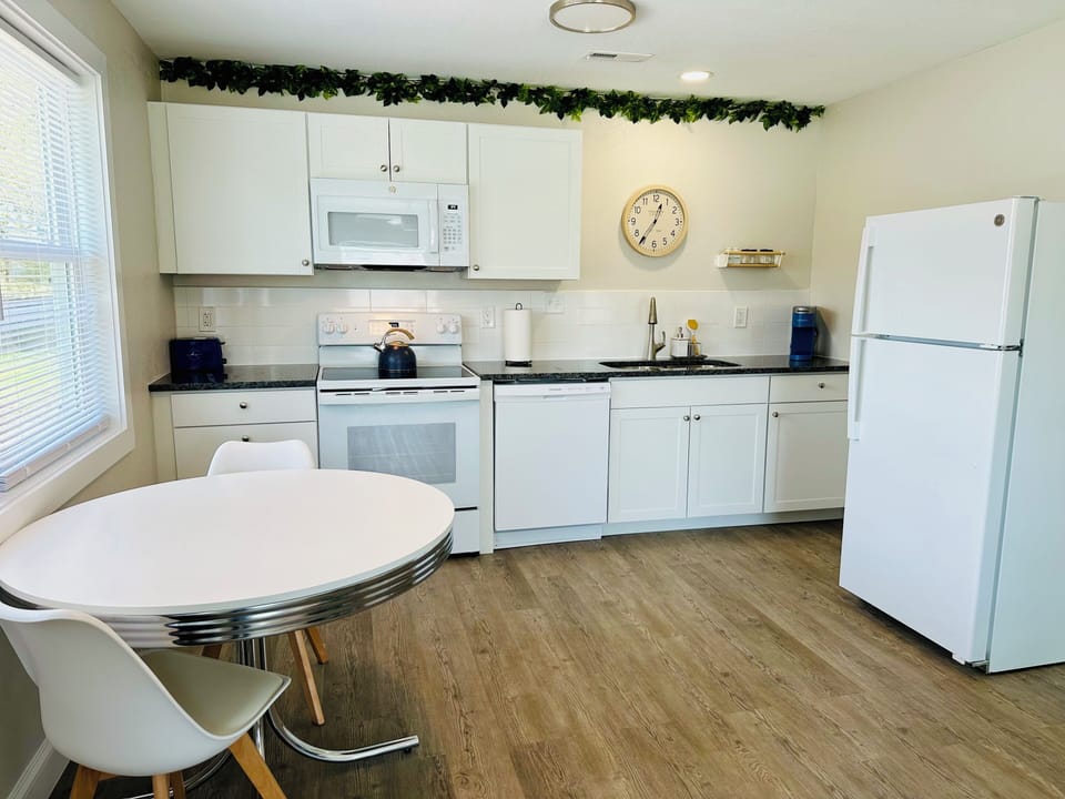 Full kitchen with all amenities including coffee maker, cookware, dishware