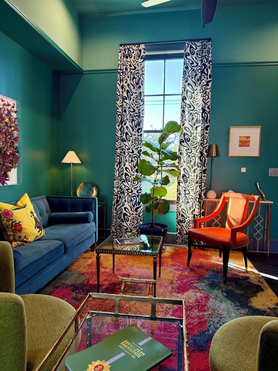 Spacious living room with 12-ft ceilings and abundant natural light.