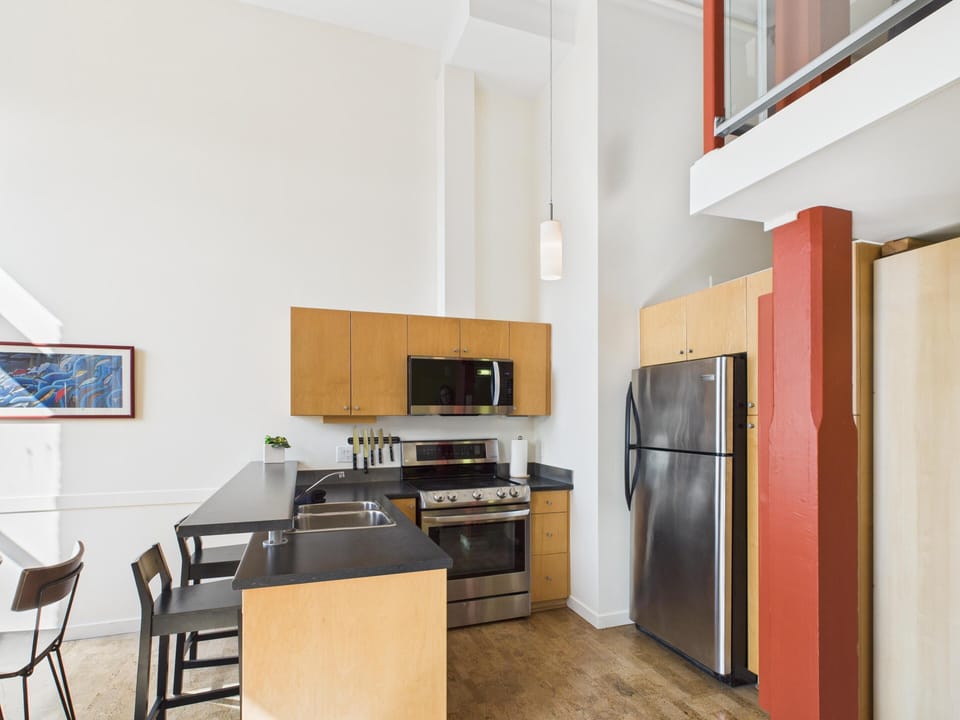 Kitchen breakfast bar with counter seating, creating a functional spot for quick breakfasts or remote work.
