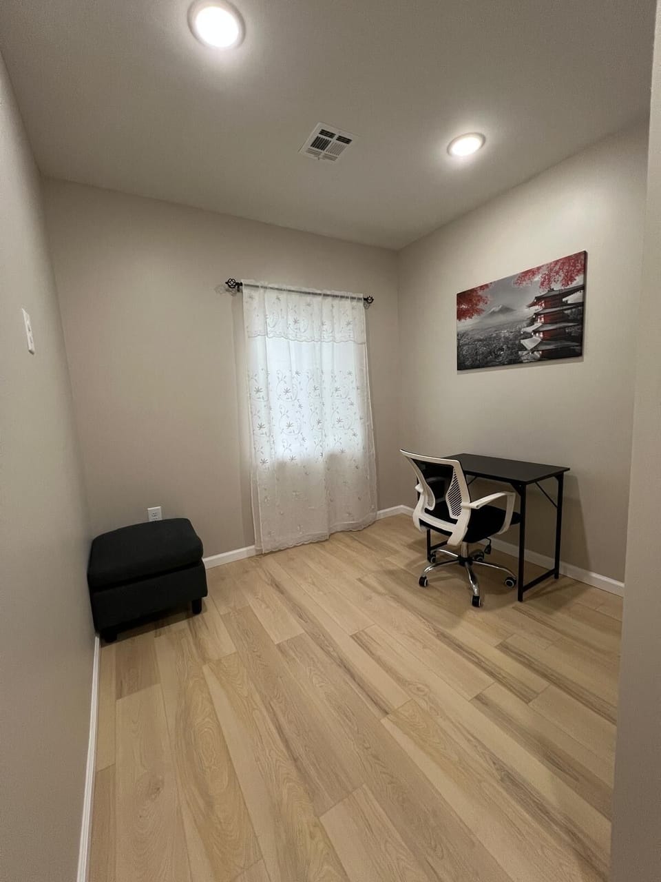 Third bedroom with cozy bed and workspace—ideal for guests, kids, or work.