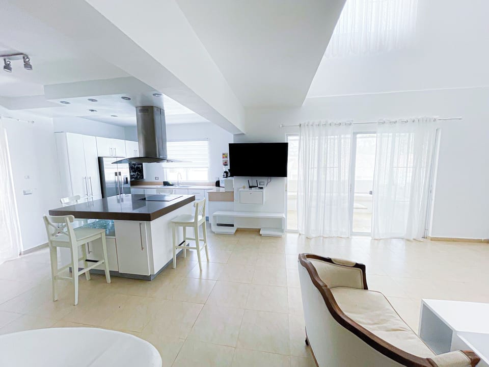 Penthouse, Pool View, Beachside | Private kitchen | Fridge, stovetop, cookware/dishes/utensils, dining tables