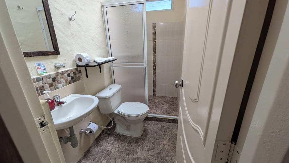 Quadruple Room | Bathroom | Shower, soap, toilet paper