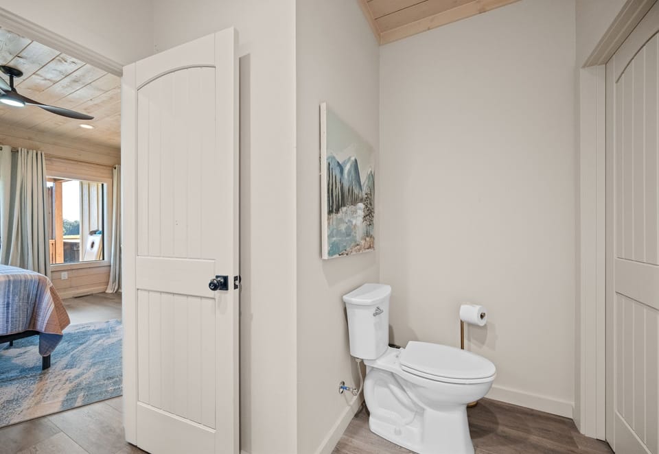 Half bath with modern finishes for guests’ convenience.