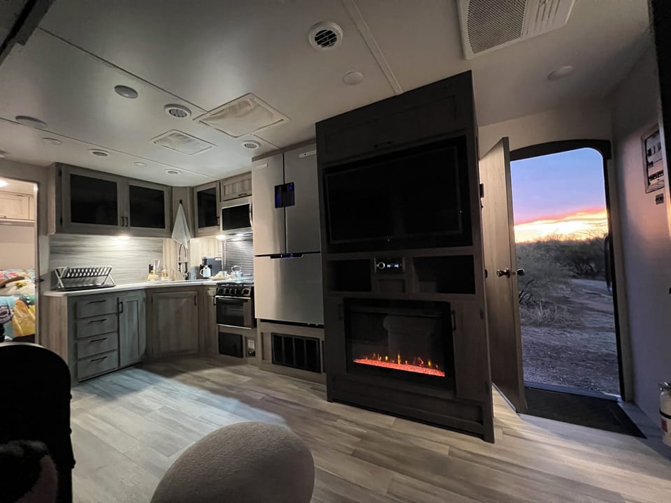 Electric fireplace that gives off heat/ ambient color changing light.