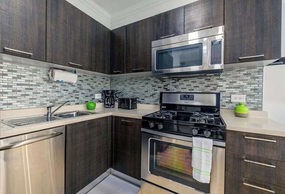 Cook, Dine, and Relax in Style. Fully equipped with high-end stainless-steel appliances, including a full-sized gas range, oven, and microwave.