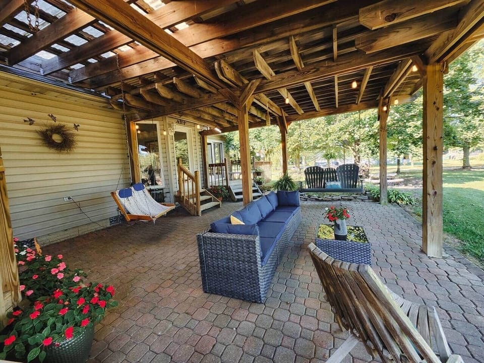 The covered patio provides plenty of outdoor seating.