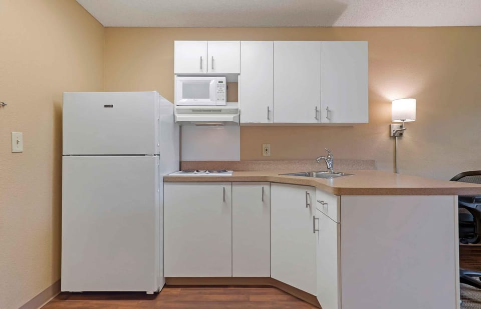 Studio, 1 Queen Bed, Non Smoking | Private kitchen | Full-size fridge, microwave, stovetop, coffee/tea maker
