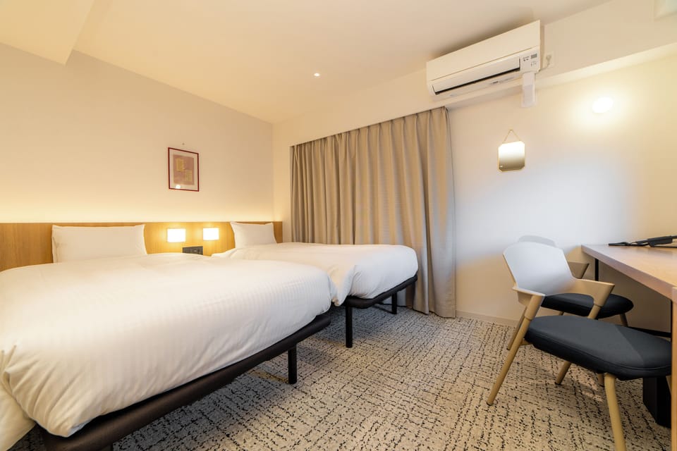 Twin Room, Non Smoking | Down comforters, in-room safe, desk, laptop workspace