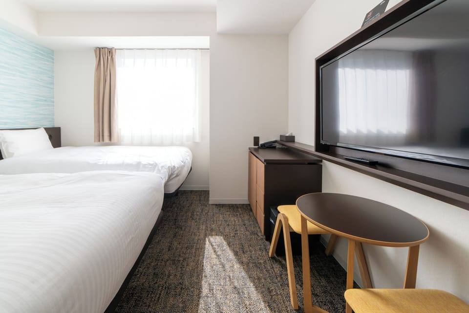 Twin Room, Non Smoking | Down comforters, in-room safe, desk, blackout drapes