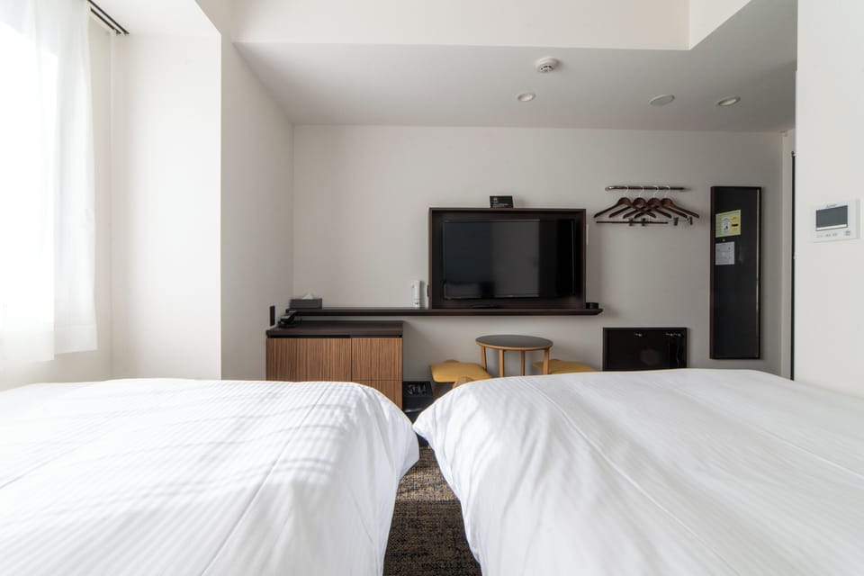 Twin Room, Non Smoking | Down comforters, in-room safe, desk, blackout drapes