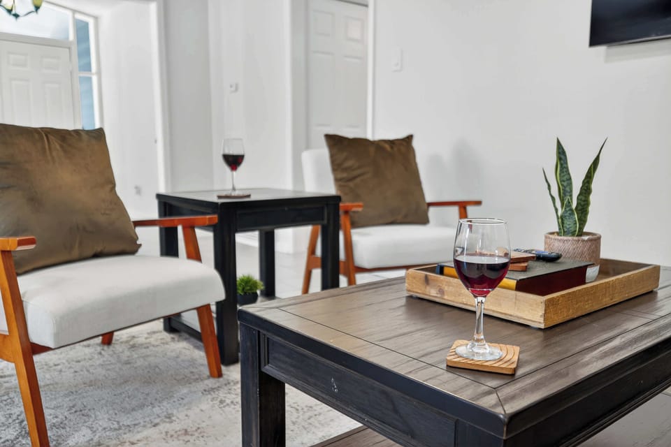Living Room Retreat: Bright space with stylish seating, perfect for sipping wine and relaxing!
