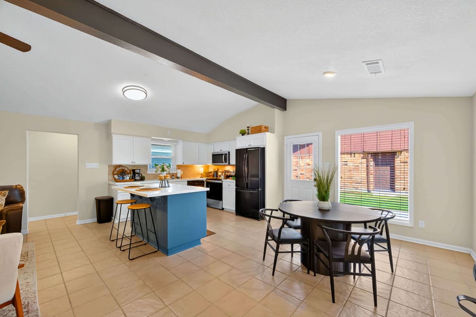 Kitchen & Dining: Bright and airy space with modern decor and a cheerful dining nook.