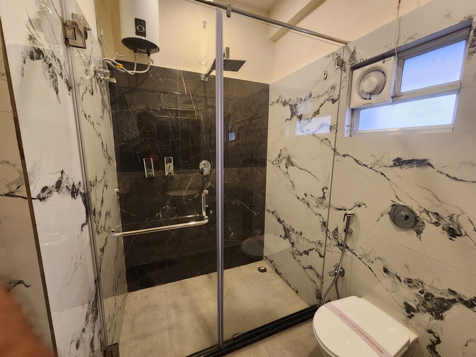Premium Double Room, Balcony, City View | Bathroom | Shower, towels, soap, shampoo
