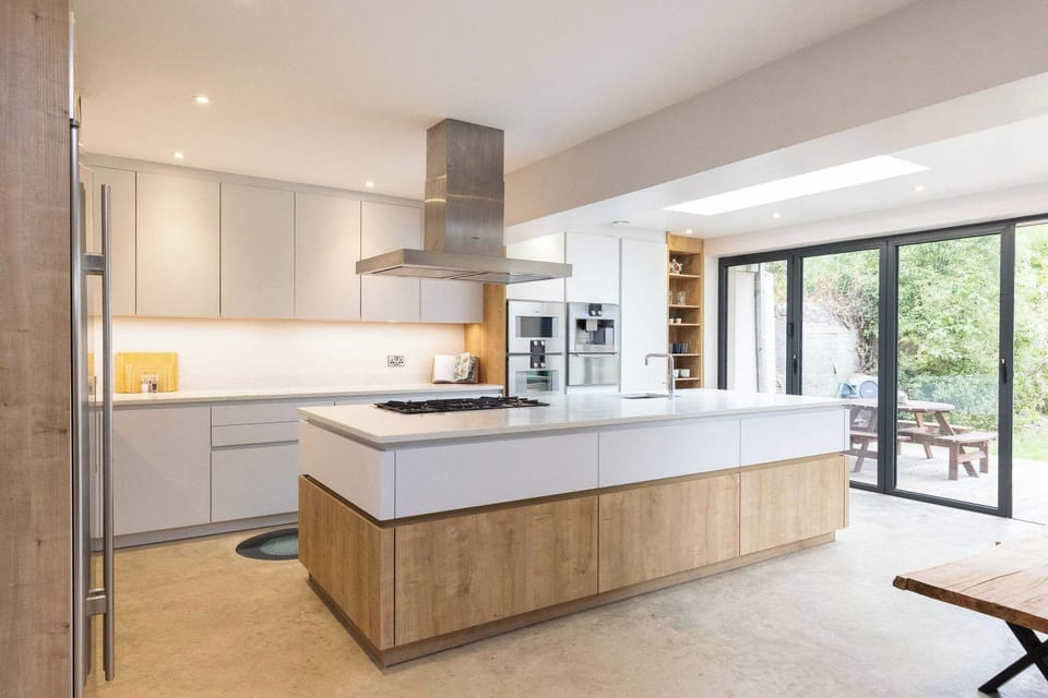 This large kitchen includes a centre island with hob and sink, perfect for cooking and entertaining.