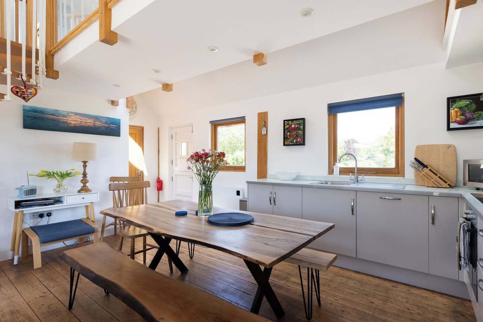 Enjoy meals and catching up with loved ones in the stylish open-plan kitchen and dining area.