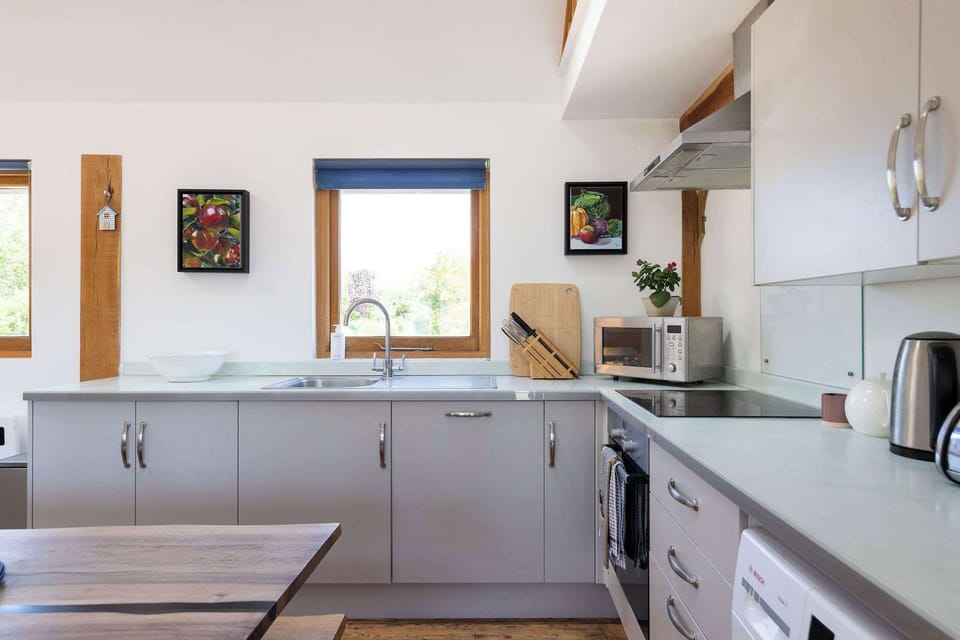 Our fully equipped kitchen boasts a coffee maker, microwave, oven, and more.