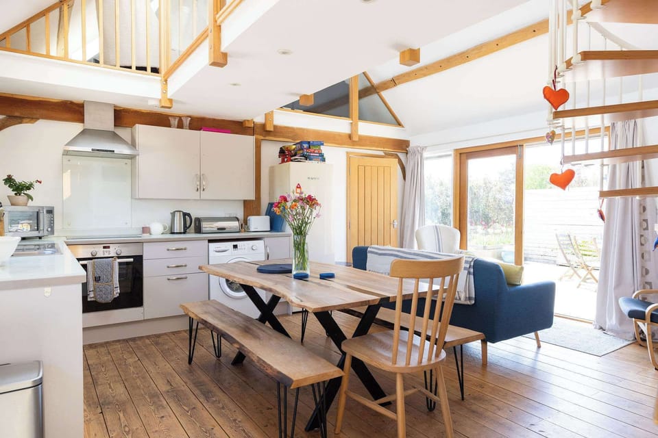 Enjoy cooking and dining together in this inviting barn conversion, offering both style and comfort.