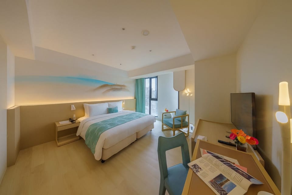 Deluxe Room, 1 King Bed | Down comforters, individually decorated, desk, laptop workspace