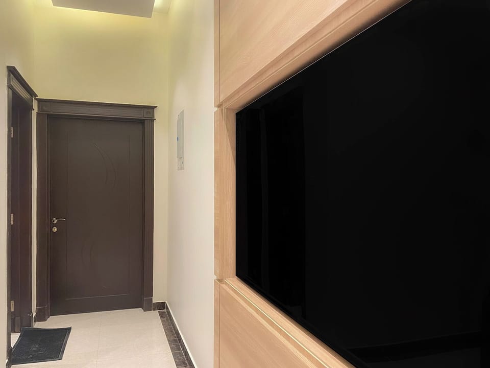 Standard Studio Suite | Living area | 60-inch flat-screen TV with cable channels