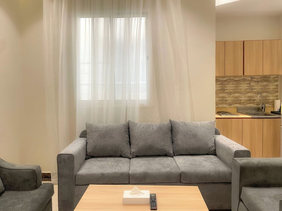 Standard Studio Suite | Living area | 60-inch flat-screen TV with cable channels