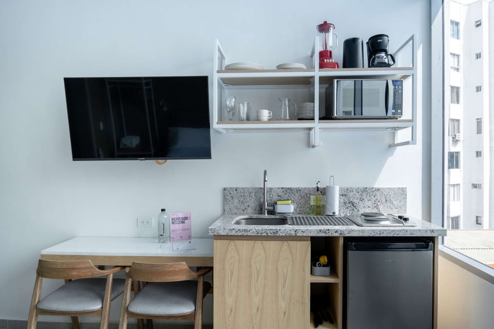 Compact kitchenette with wooden finishes