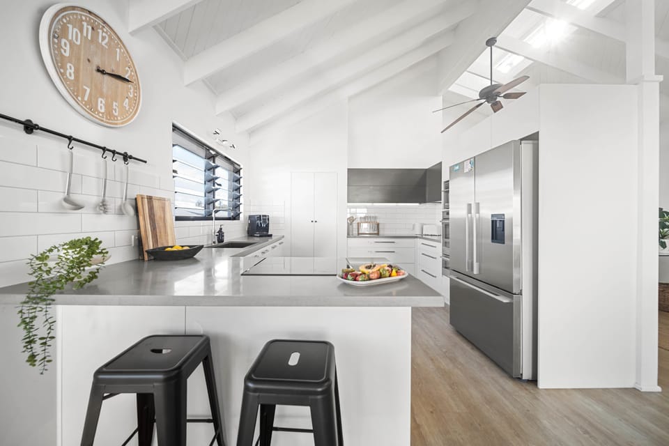 Cook with ease in the fully equipped kitchen featuring generous bench space.