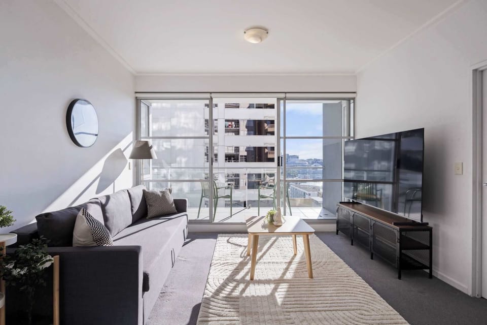 A spacious living with a 3-seater sofa bed that folds out to a double.