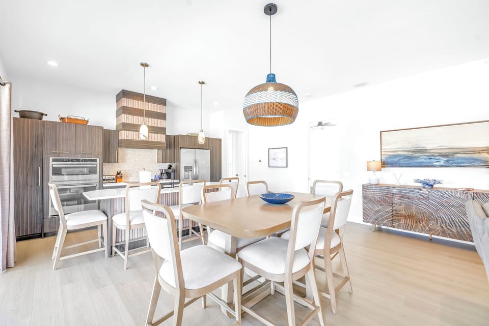 Dining area in large living room, with 11 foot ceilings.