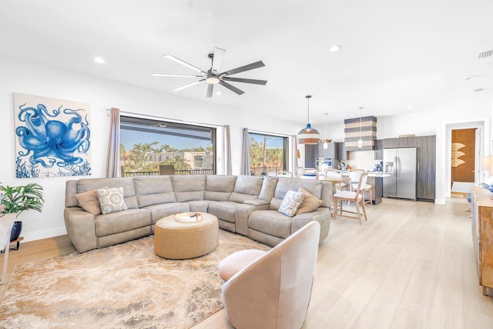 Dining area in large living room, with full length balcony.