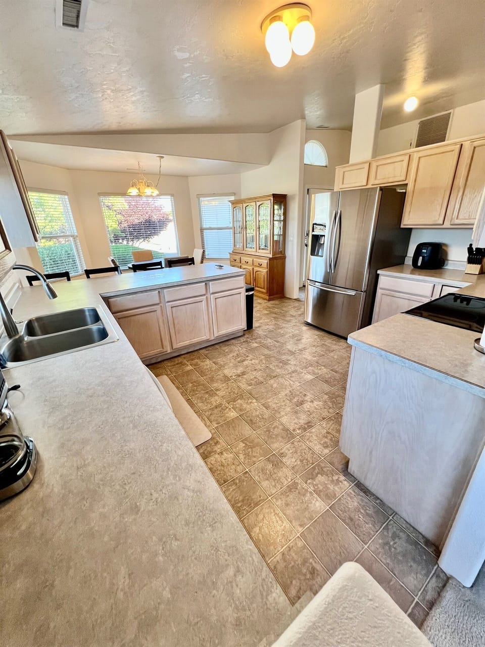 Cooking is a breeze in this fully equipped kitchen, featuring modern appliances and ample counter space.
