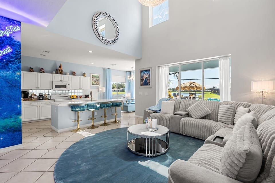 Frozen-Inspired Living Room – Bright and airy with icy-blue tones and castle artwork for a cozy Arendelle vibe.