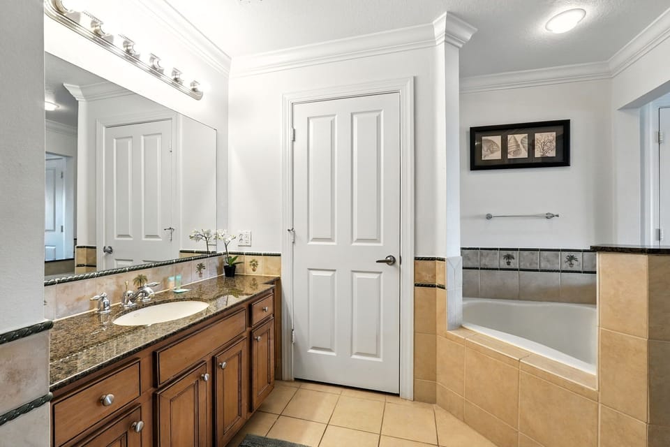 A clean and calming bathroom featuring a relaxing bathtub—your perfect spot to unwind and refresh.