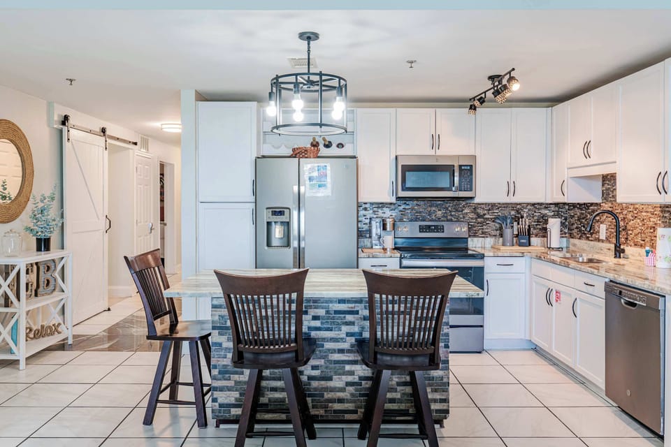 Cook, chat, and connect in this open kitchen with bar seating